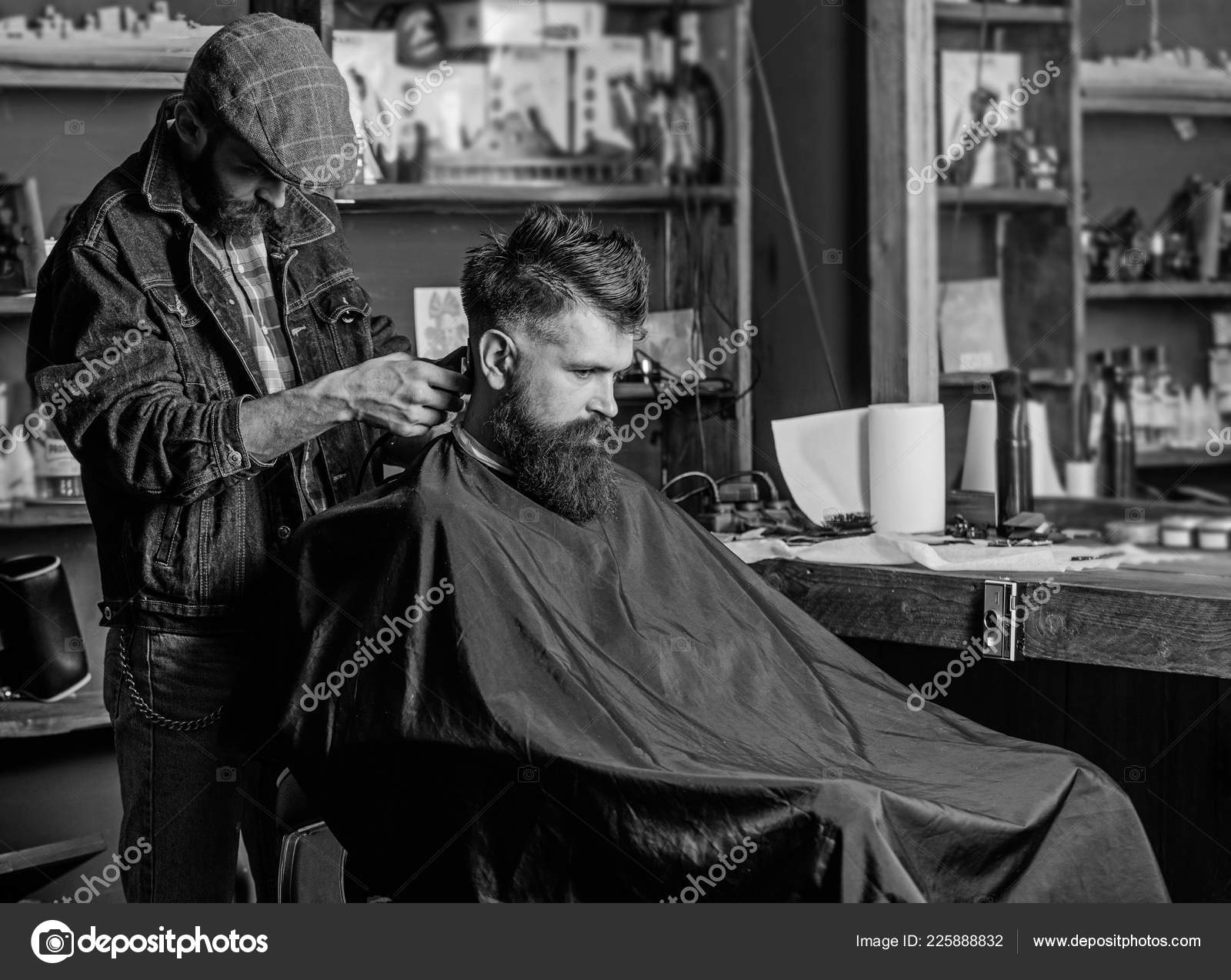 Barber With Hair Clipper Works On Haircut Of Bearded Guy Retro