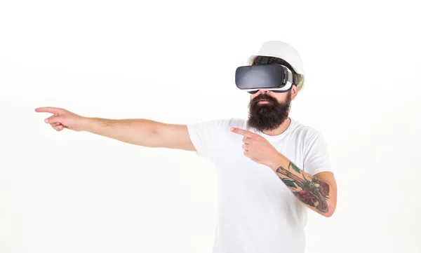 Man with virtual reality headset. Man wearing virtual reality goggles in white background. Smartphone using with VR headset.