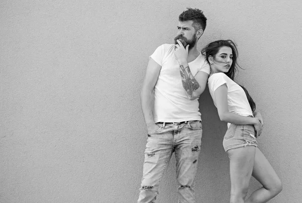 Stylish couple. Modern youth choose comfortable clothing. Fashion trend comfortable simple clothing for man and woman. Couple grey background. Urban lifestyle demand comfortable clothes for every day