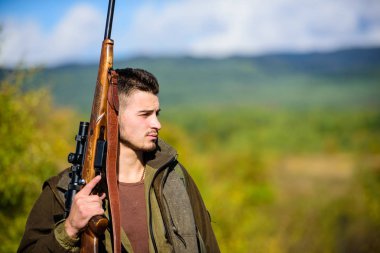 Man hunter carry rifle nature background. Experience and practice lends success hunting. Guy hunting nature environment. Masculine hobby activity. Hunting season. Hunting weapon gun or rifle clipart