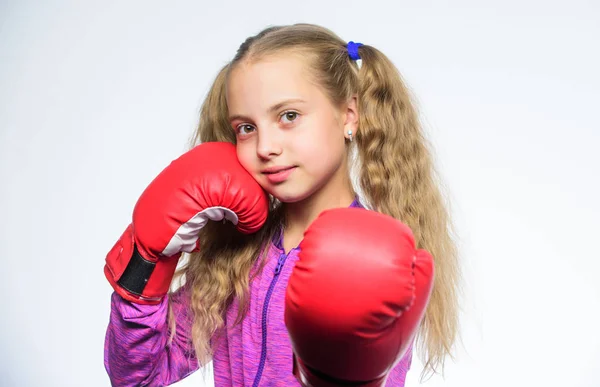 knockout and energy. Sport success. Sport and sportswear fashion. training with coach. Fight. little girl in boxing gloves punching. Boxer child workout, healthy fitness. Caucasian boxer