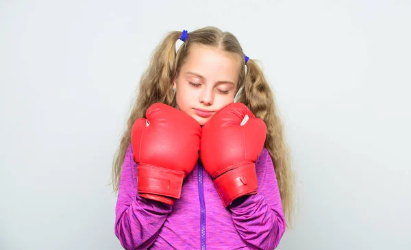sleepy kid exhausted after boxing. knockout and energy. Sport success. sportswear fashion. training with coach. Fight. little girl in boxing gloves, punching. Boxer child workout. healthy fitness