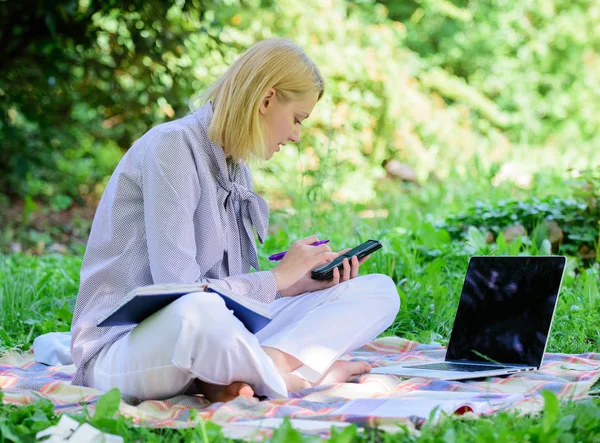 Managing business outdoors. Woman with laptop sit grass meadow. Business lady freelance work outdoors. Become successful freelancer. Freelance career concept. Guide starting freelance career — Stock Photo, Image