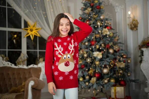 Christmas. Kid enjoy the holiday. The morning before Xmas. New year holiday. Happy new year. little child girl likes xmas present. small happy girl at christmas. New year new me. winter fashion