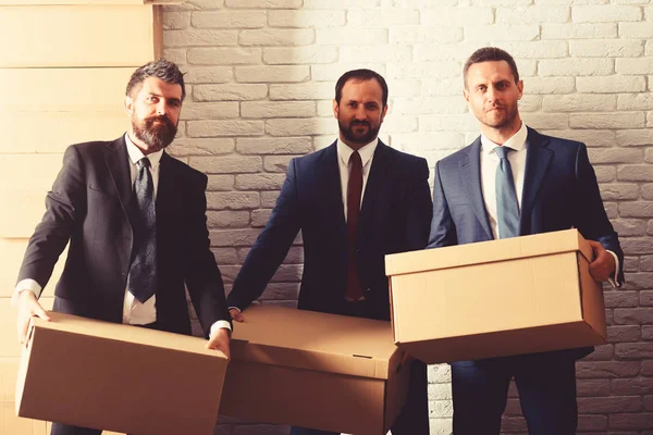 Businessmen wear smart suits and ties. Men with beard