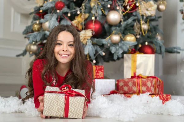 Christmas. Kid enjoy the holiday. The morning before Xmas. New year holiday. Happy new year. little child girl likes xmas present. small happy girl at christmas. Christmas is the time to please — Stock Photo, Image