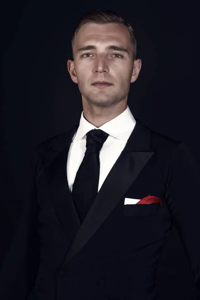 Confident attractive young man in tuxedo — Stock Photo, Image