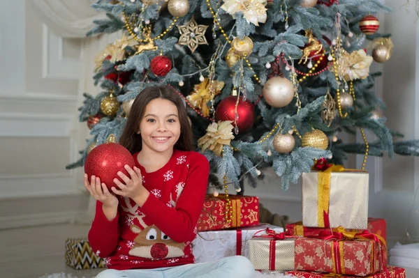 Christmas. Are you ready. Kid enjoy the holiday. Happy new year. The morning before Xmas. New year holiday. small happy girl at christmas. little child girl likes xmas present. red ball — Stock Photo, Image