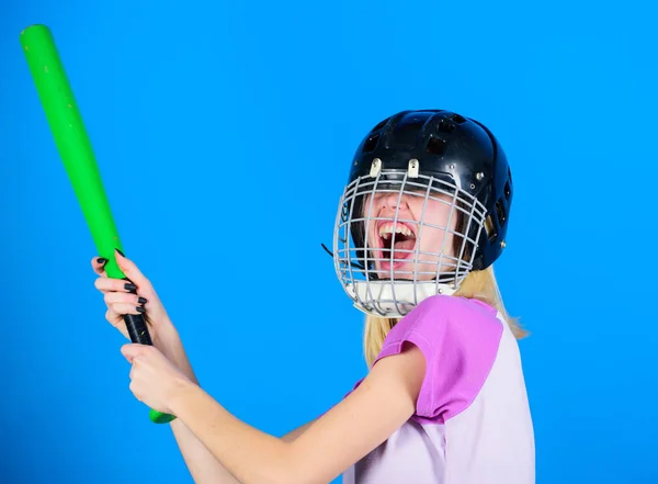 Woman in baseball sport. Girl confident pretty blonde wear baseball helmet and hold bat on blue background. Baseball female player concept. Ready repel attack. Woman enjoy play baseball game