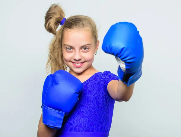 Boxer child workout, healthy fitness. ready to fight. knockout and energy. Sport success. training with coach. Fight. Sport and sportswear fashion. little girl in boxing gloves punching