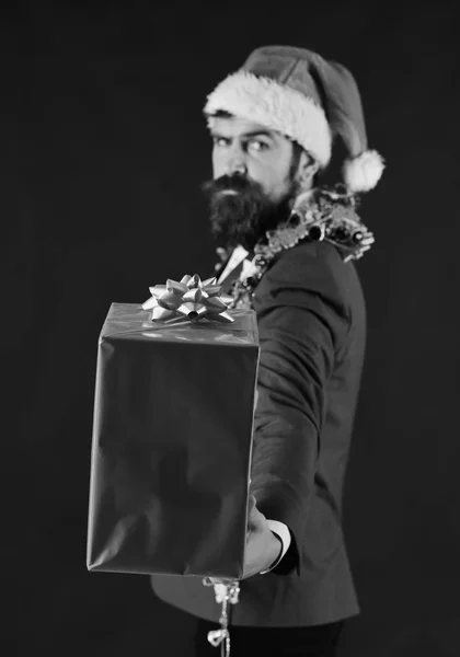 Business and celebration concept. Man in suit, Santa hat, garlands — Stock Photo, Image