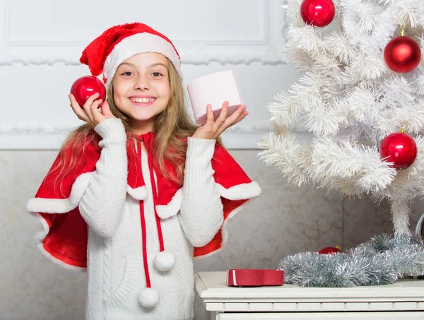 Unpacking christmas gift. Happy celebration concept. Winter holiday tradition. Kid with christmas present. Reason children love christmas. Girl celebrate christmas open gift box. Santa bring her gift