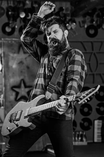 Musician with beard play electric guitar. Man with enthusiastic face — Stock Photo, Image