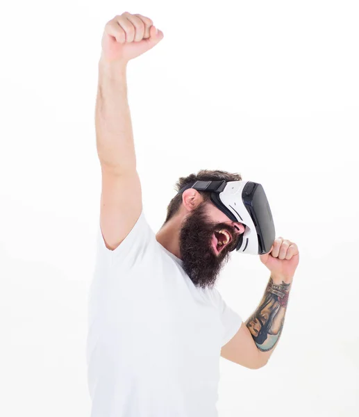 Man bearded gamer VR glasses white background. Cyber reality game concept. Win virtual contest. Guy with head mounted display interact virtual reality. Hipster play virtual game. Virtual success