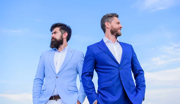 Perfect in every detail. Business men stand blue sky background. Business people concept. Well groomed appearance improves business reputation entrepreneur. Bearded business people posing confidently — Stock Photo, Image