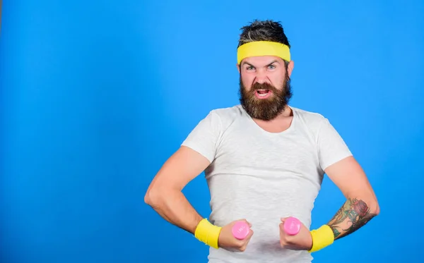 Man bearded athlete exercising dumbbell. If you want to be strong. Motivated athlete guy. Join my sport class. Sportsman retro outfit training blue background. Athlete training with cute dumbbell — Stock Photo, Image