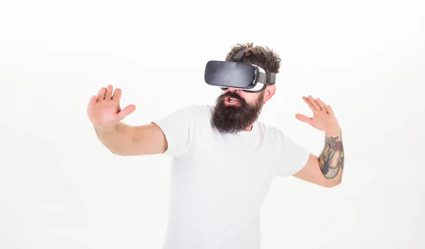 Hipster play virtual sport game. Man bearded gamer VR glasses white background. Virtual reality game concept. Cyber sport. Guy with head mounted display interact virtual reality. Virtual activity