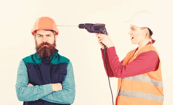 Man with annoyed face in helmet. Family making repair,