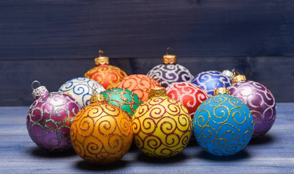 Balls with glitter and shimmering decorative ornaments. Christmas ornaments decorations on vintage wooden background. Christmas decorations concept. Pick colorful decorations. Modern christmas decor