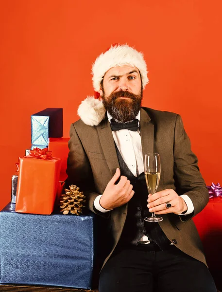 Xmas corporate party concept. Man with beard holds champagne.