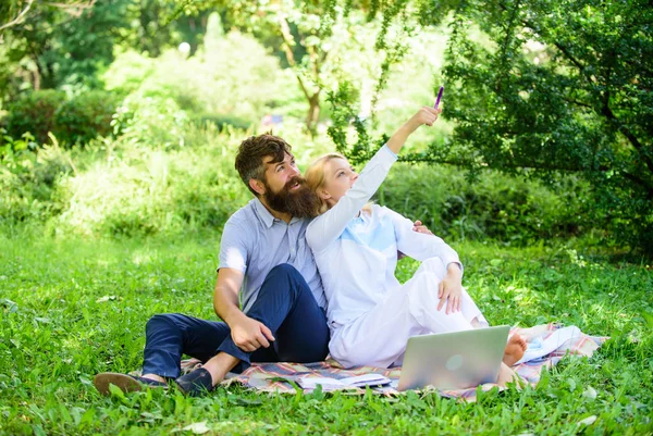 Modern online business. Freelance life benefit concept. Couple youth spend leisure outdoors working with laptop. How to balance freelance and family life. Couple in love or family work freelance