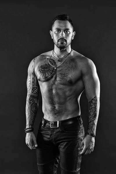 Man brutal unshaven hispanic appearance tattooed arms. Bearded man show tattooed torso. Brutal strict macho with tattoos. Masculinity and brutality. Tattoo culture concept. Tattoo brutal attribute — Stock Photo, Image