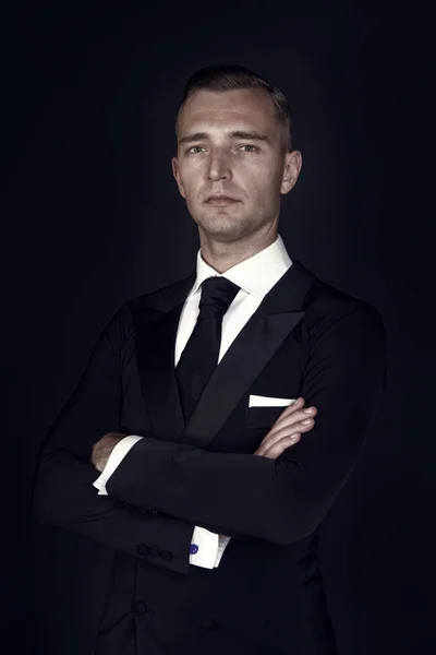 Man in a black tuxedo suit and white shirt — Stock Photo, Image