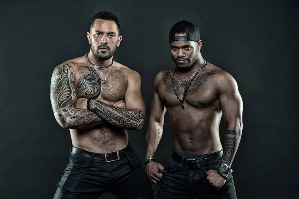 Tattoo brutal attribute. Men brutal attractive hispanic appearance tattooed body. Bearded men show tattooed torso. Brutal strict macho with tattoos. Masculinity and brutality. Tattoo culture concept - Stock Image - Everypixel Tattoo brutal attribute. Men brutal attractive hispanic appearance tattooed body. Bearded men show tattooed torso. Brutal strict macho with tattoos. Masculinity and brutality. Tattoo culture concept - Stock Image - Everypixel