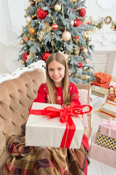 This is for you. Happy child celebrate christmas and new year. Child girl prepare for boxing day holiday. Little girl with gift box. Boxing day is the day after Christmas. Happy new year