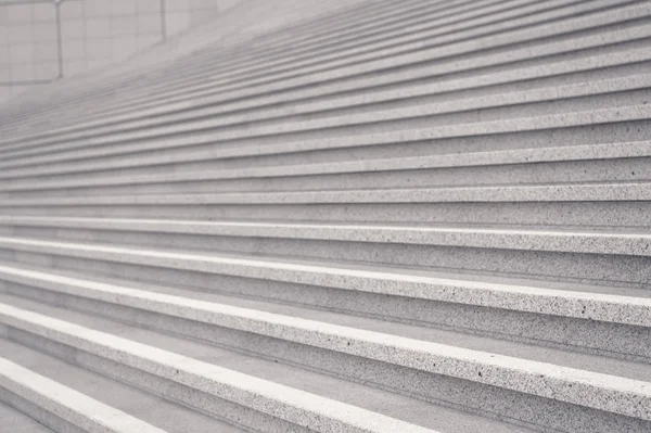 Stairway with concrete stairs on grey background in Paris, France