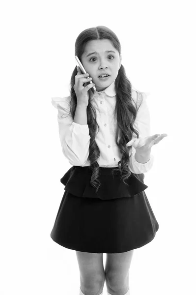 Girl cute long hair talk smartphone white background. Child desperate helpless face expression speak smartphone. Communication with parent important part educational process. Explain her mistake — Stock Photo, Image