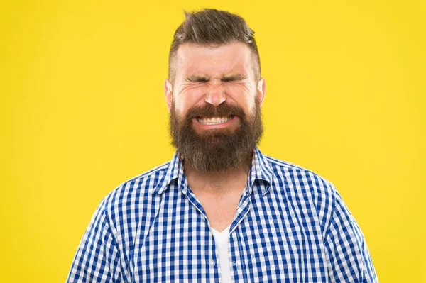 Just sneezed. Man bearded hipster with sneezing face closed eyes close up yellow background. Brutal hipster sneezing. Allergy season concept. Take allergy medications. Can not stop sneezing — Stock Photo, Image