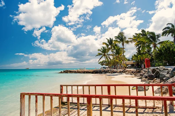 Pier with railing on tropical beach in st johns, antigua — Stock Photo, Image