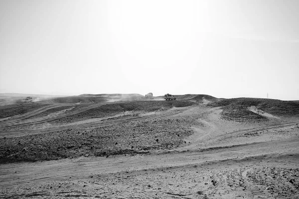 Car overcome sand dunes obstacles. Competition racing challenge desert. Car drives offroad with clouds of dust. Offroad vehicle racing obstacles in wilderness. Endless wilderness. Race in sand desert — Stock Photo, Image