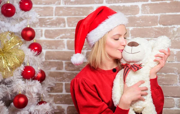 Receive teddy bear as gift. Wish you merry christmas. Top list best gifts for family. Cute and tender gift. Woman santa hat hug soft toy bear. Best gift ever. Girl happy celebrate new year christmas