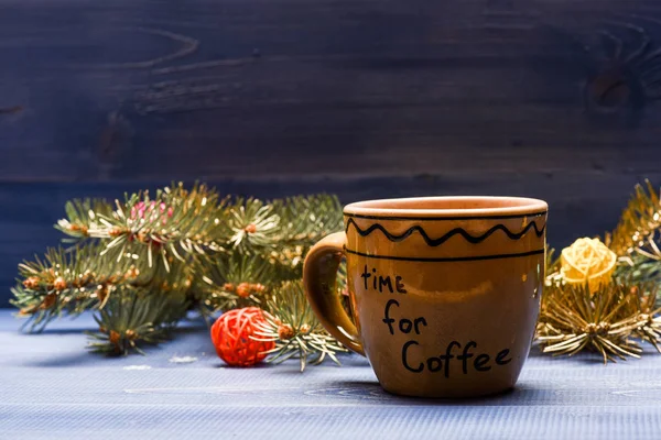 Enjoy winter drink. Coffee time concept. Winter beverage with caffeine. Drink coffee christmas eve. Ceramic cup with inscription time for coffee. Mug for coffee with christmas decorations background