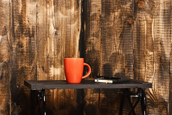 Tea or coffee cup for drink with copybook and pen — Stock Photo, Image