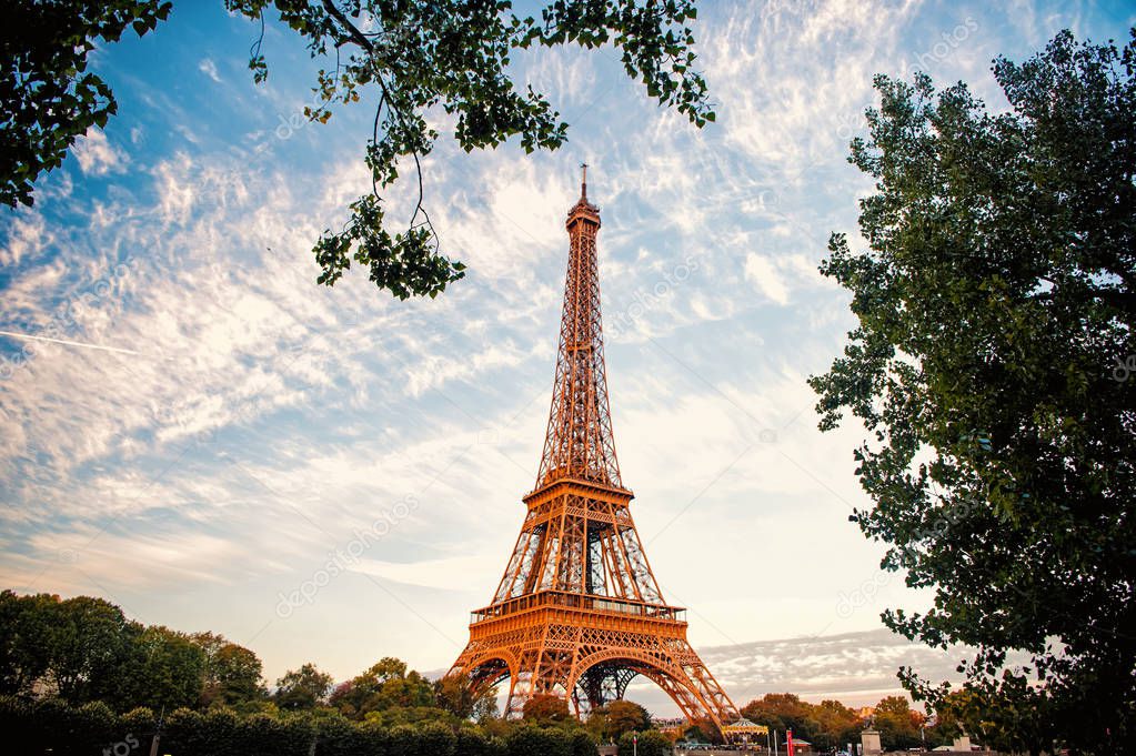 Eiffel Tower at sunset in Paris, France. HDR. Romantic travel background.
