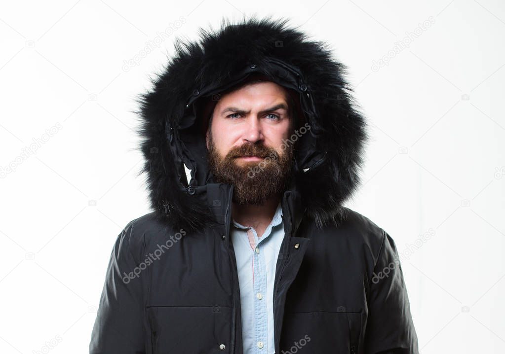 Winter outfit. Hipster winter fashion. Guy wear black winter jacket with hood. Prepared for weather changes. Winter stylish menswear. Man bearded stand warm jacket parka isolated on white background