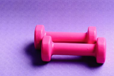 Barbells in small size, close up. Sports and healthy lifestyle clipart