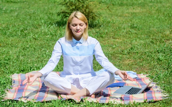 Woman relaxing practicing meditation. Every day meditation. Reasons you should meditate every day. Clear your mind. Girl meditate on rug green grass meadow nature background. Find minute to relax