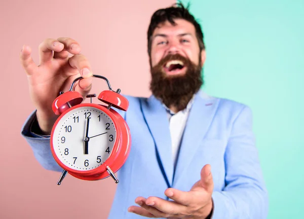 Timely concept. Hipster happy working day is over. Businessman finished on time. Time management skills. Best time of day. Just in time. Man bearded happy cheerful businessman hold alarm clock