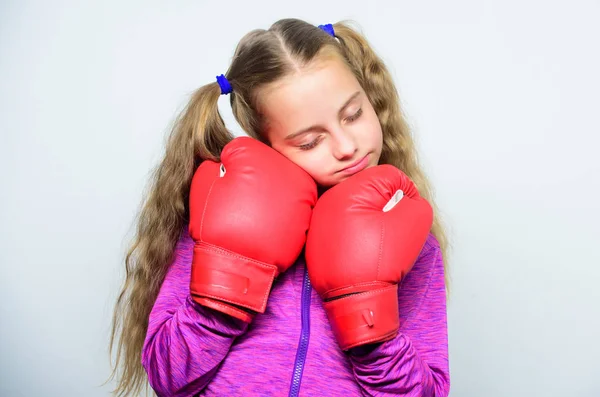 Girl cute child with red gloves posing on white background. Sport upbringing. Upbringing for leader. Strong child boxing. Sport and health concept. Boxing sport for female. Skill of successful leader