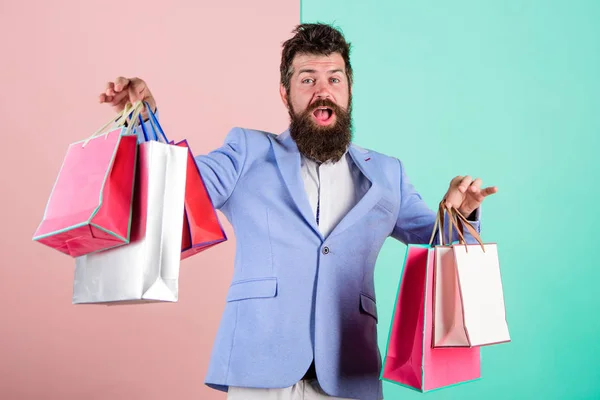 Buy gifts in advance. Enjoy shopping black friday. Hipster shopping with discount. Man bearded hipster businessman formal suit carry paper shopping bags. Buy gifts for everyone. Ready for holiday — Stock Photo, Image