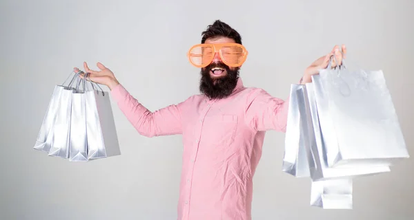 Happy shopping with bunch paper bags. Shopping addicted consumer. Profitable deal. How to get ready for your next vacation. Man bearded hipster with lot shopping bags. Shopping on black friday — Stock Photo, Image