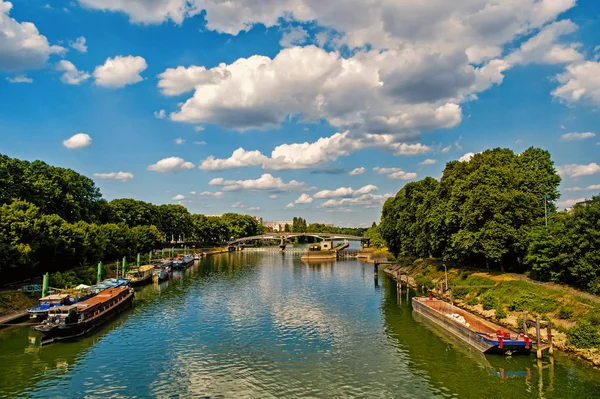 River, ships and bridge in Paris, France on natural background