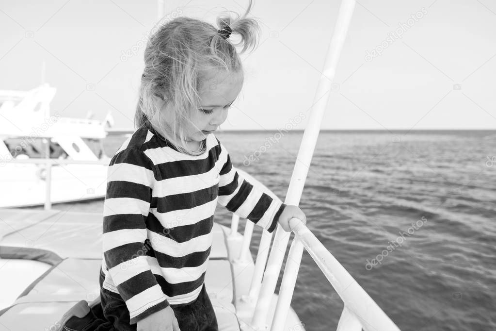 Family cruise vacations. Kid boy toddler travelling sea cruise. Child in striped shirt looks like young sailor. Child enjoy vacation on cruise ship. Family vacation on cruise ship all inclusive tour