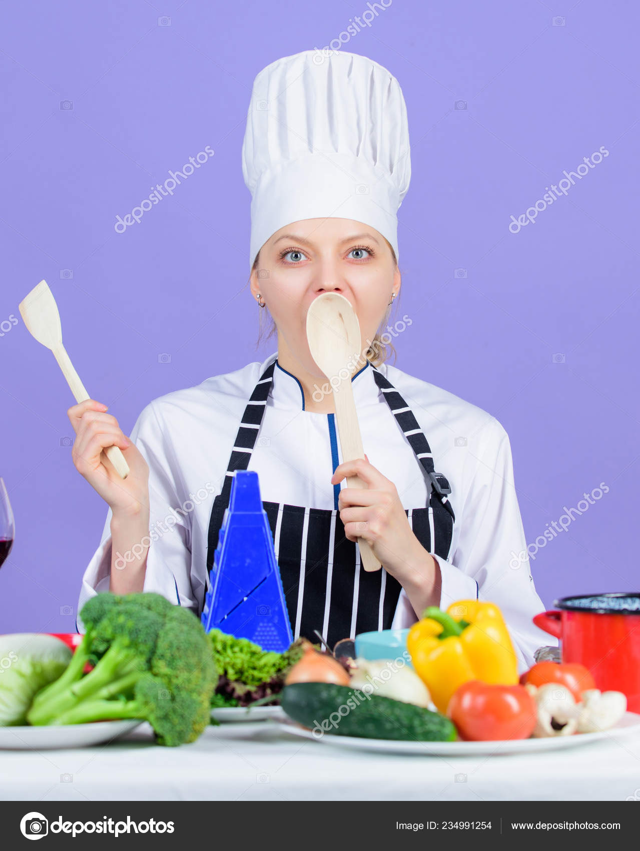 Cooking healthy food. Woman chef cooking healthy food. Fresh vegetables ...