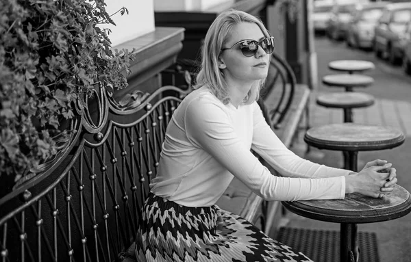 Still waiting him. Woman sits alone cafe terrace urban background defocused. Girl sit alone cafe waiting him. Woman lonely wait date. Dating advice for women. How enjoy being single tips