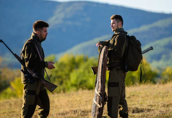 Hunting with partner provide greater measure safety often fun and rewarding. Hunters rifles nature environment. Hunter friend enjoy leisure. Hunters friends gamekeepers walk mountains background — Stock Photo, Image